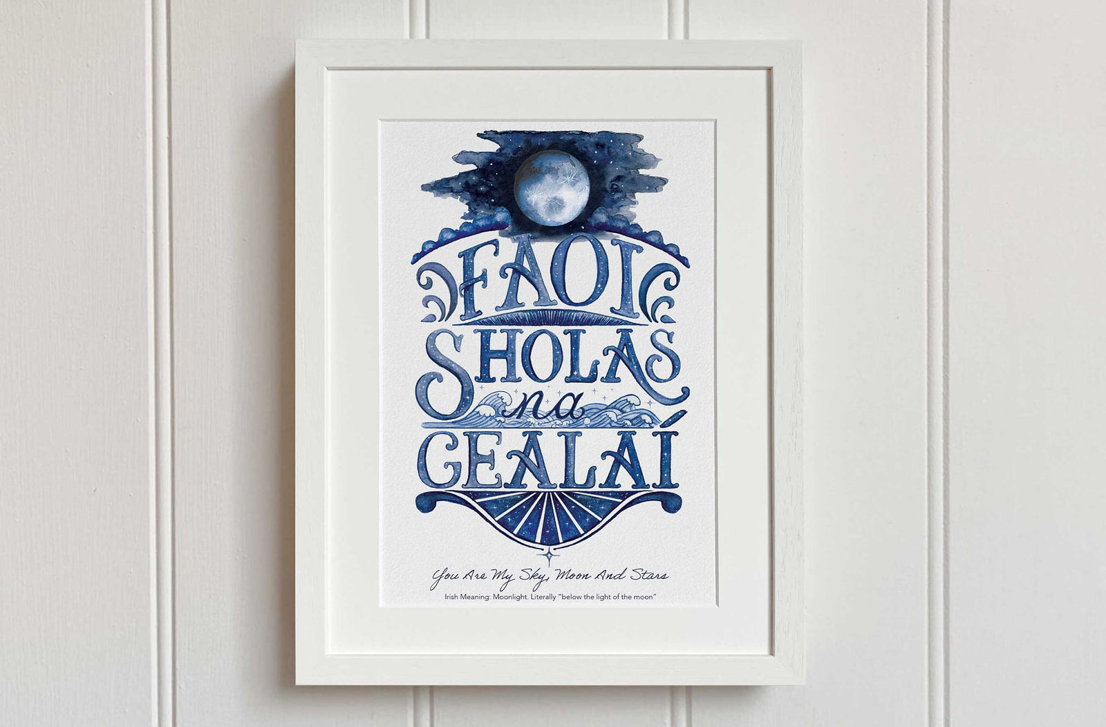 Moonlight watercolour fine art print in Irish language in white wooden frame