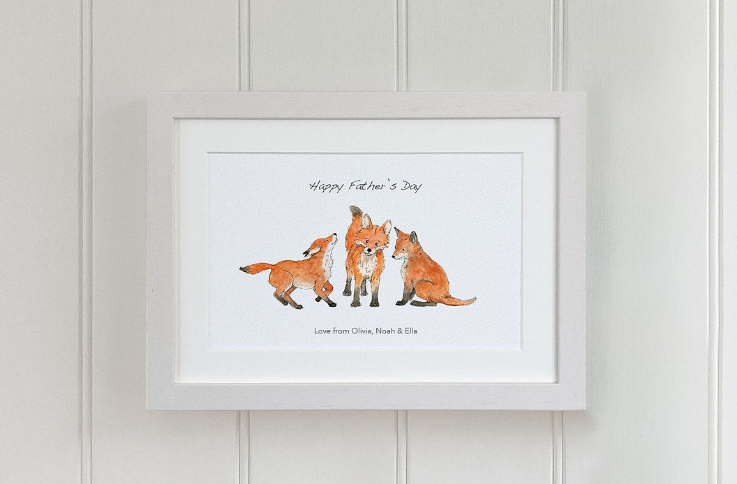 three fox cubs watercolour fine art print in white wooden frame.